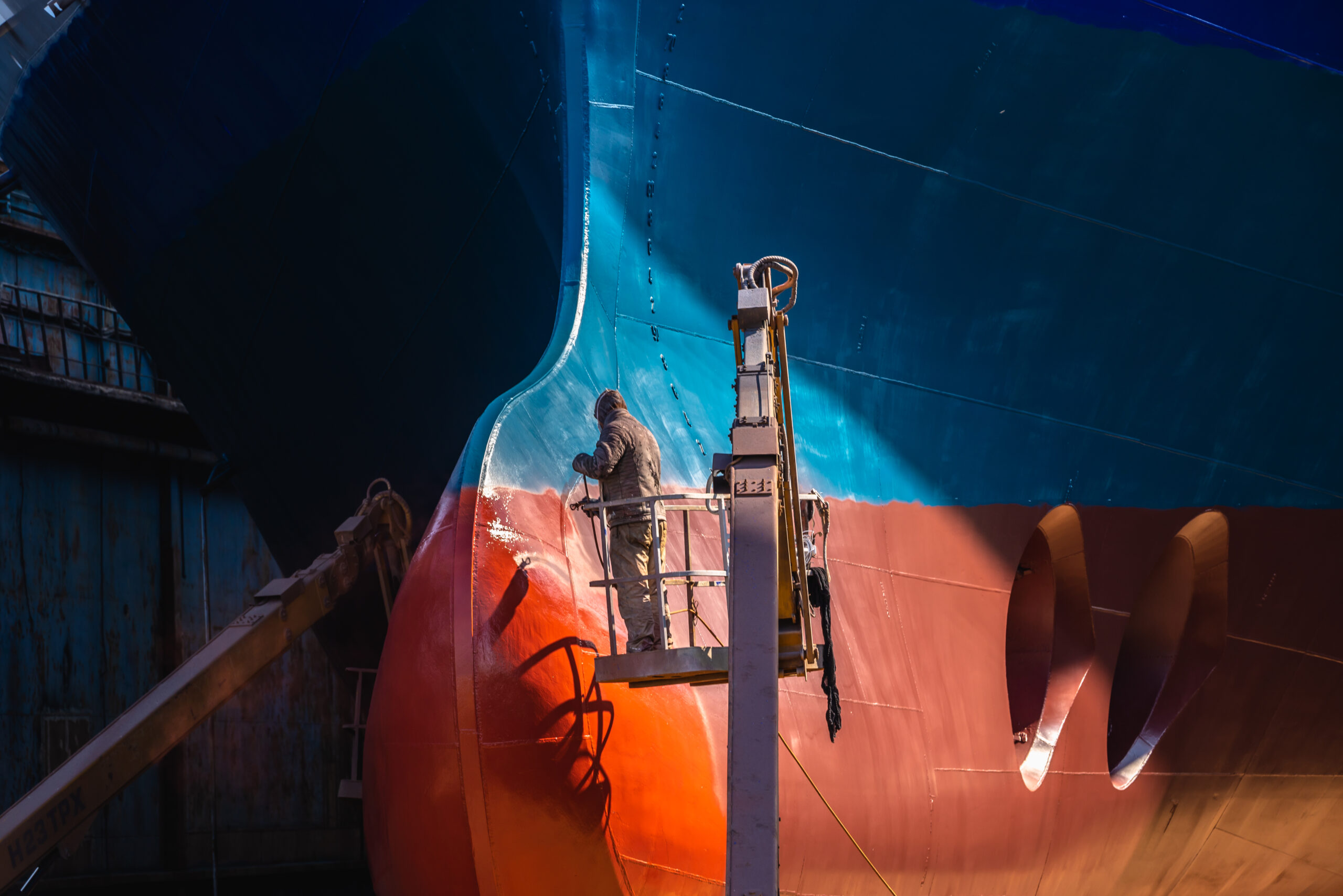 Chernomorsk, Ukraine. 21.03.2021. Painting the bottom of the ship at the dry dock of the Chernomorsk Shipyard